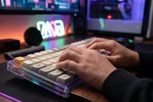 Gaming keyboard with custom XDA keycaps in a dark desk setup