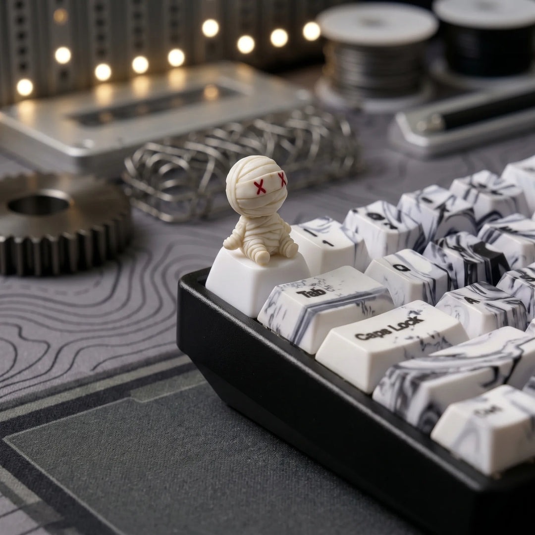Halloween X-Eye Mummy artisan keycap on a white marble custom keyboard