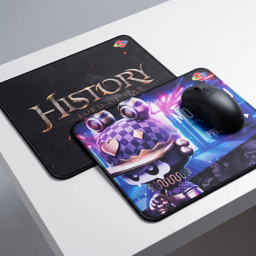 Two custom printed mouse pads featuring purple cartoon artwork and a dark fantasy design with stitched edges